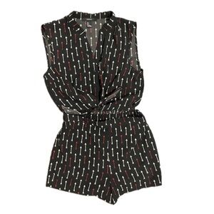 Black romper with white and red arrows. Size Small. Ties in the center